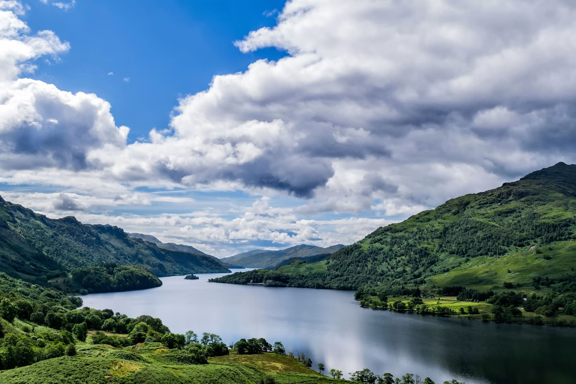 Green mountains beside a loch